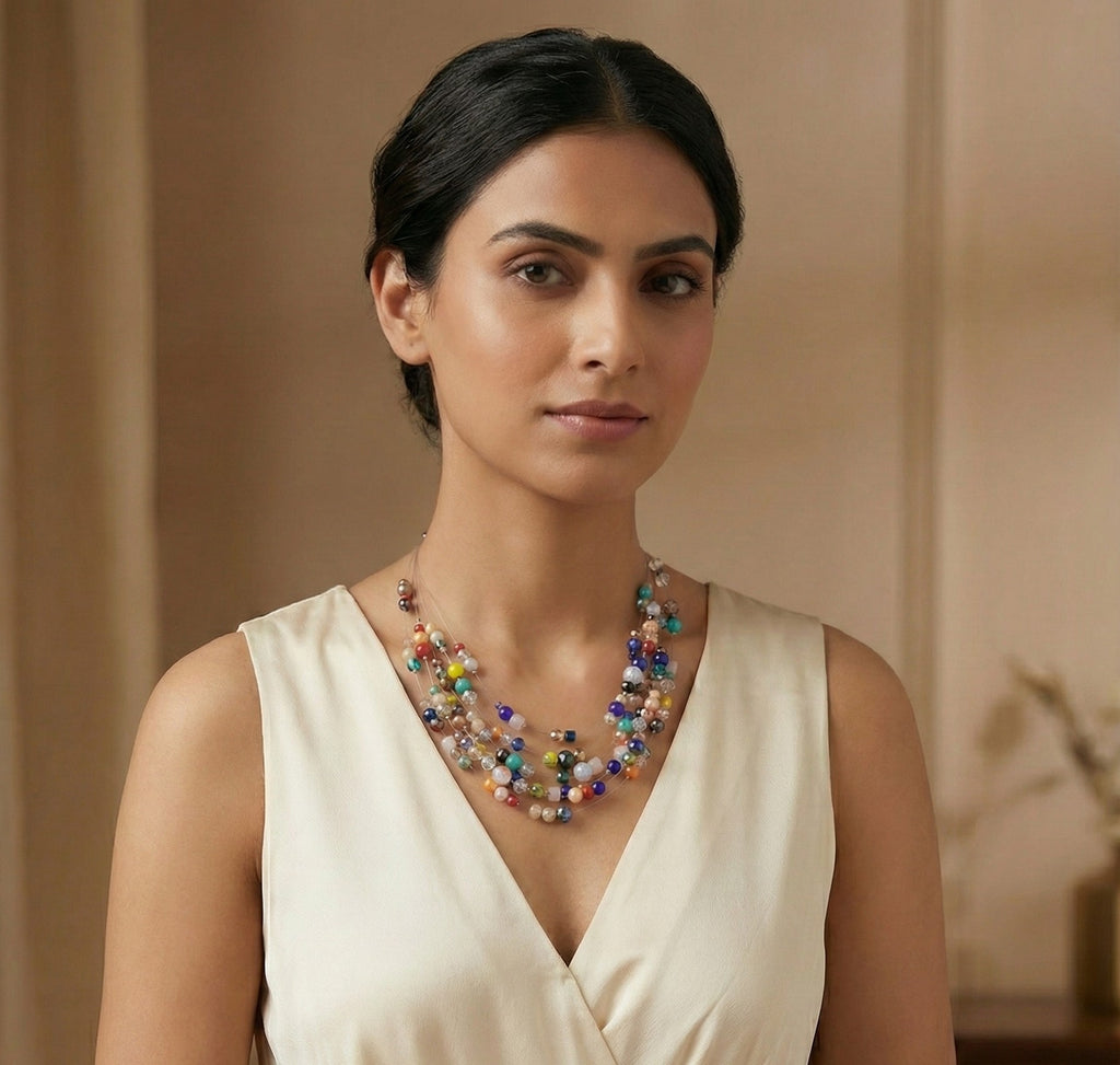 Colorful statement necklace with cascading strands of diverse faceted beads and pearls