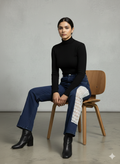Dark wash denim jeans featuring a white crochet GPO fabric panel along the outer leg