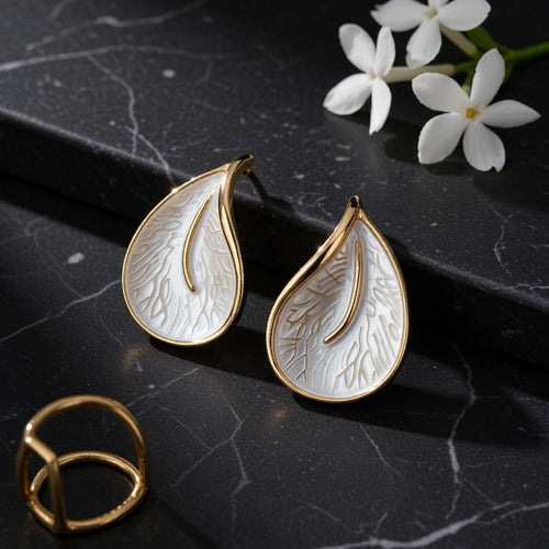 Elegant gold-plated botanical earrings with a textured pearl finish
