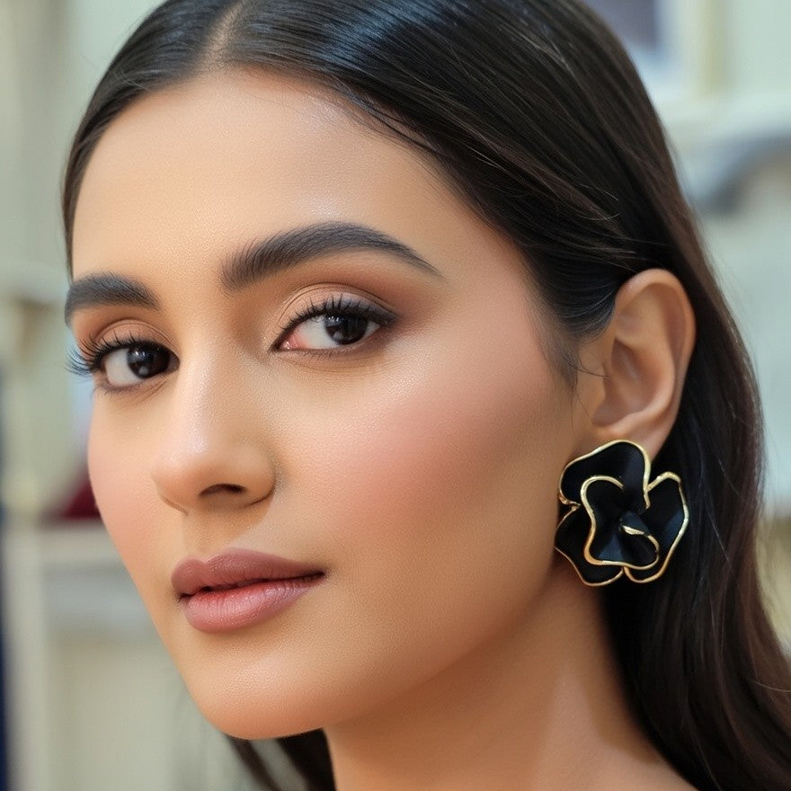 Pair of black ruffled rose earrings with gold metallic trim