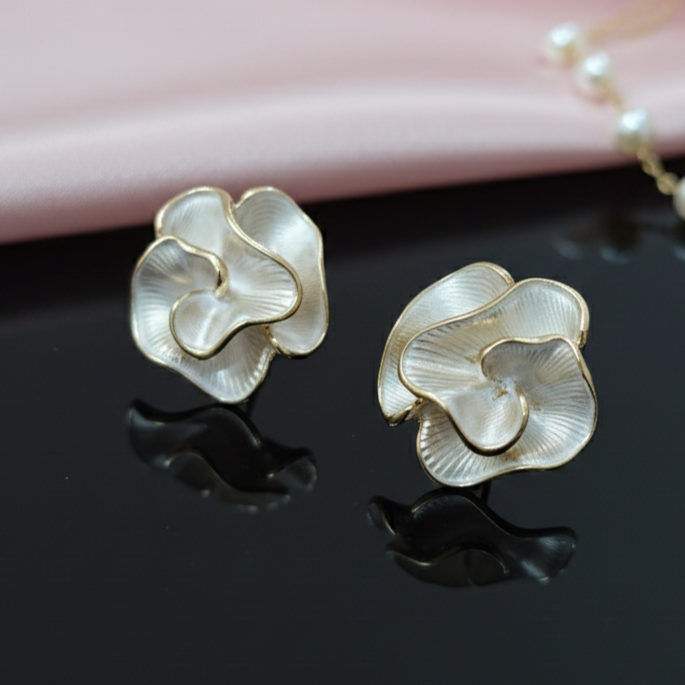 Sculptural creamy white rose earrings with gold edges