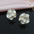 Sculptural creamy white rose earrings with gold edges